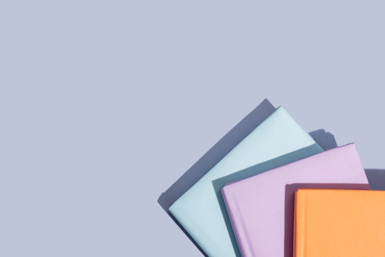 Pastel Colored Books Flatlay