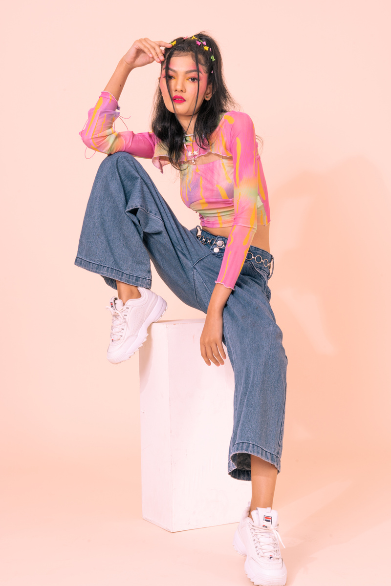 Portrait of a Young Woman in 90s Fashion